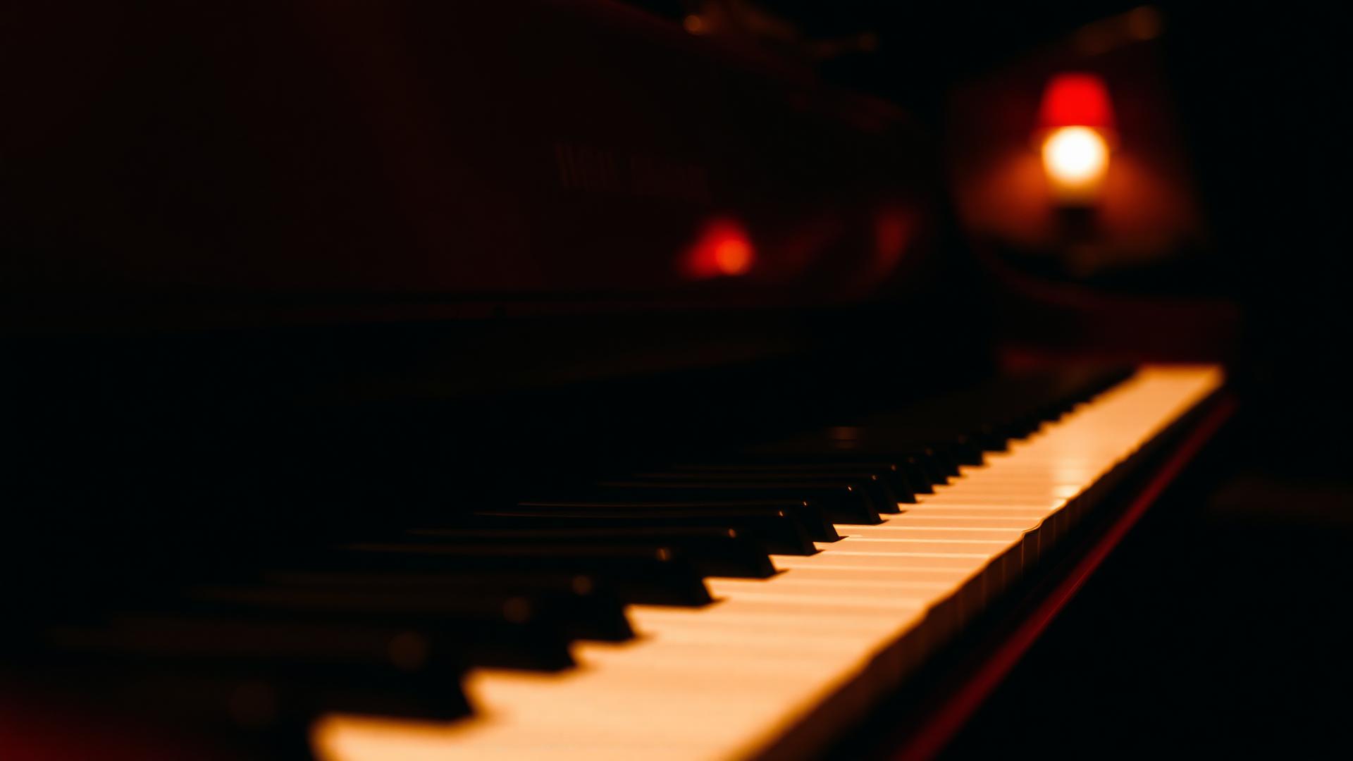 dimly lit piano keys